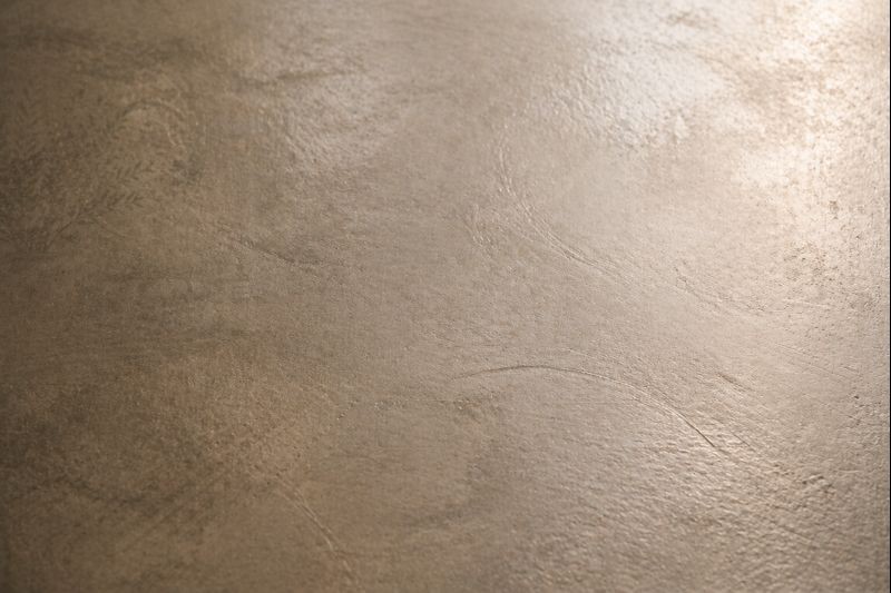 Macro texture béton ciré Marius Aurenti teinte taupe appliqué à la taloche inox